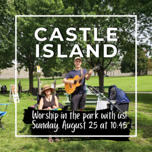 Tim plays guitar and Michelle keyboard in a park
